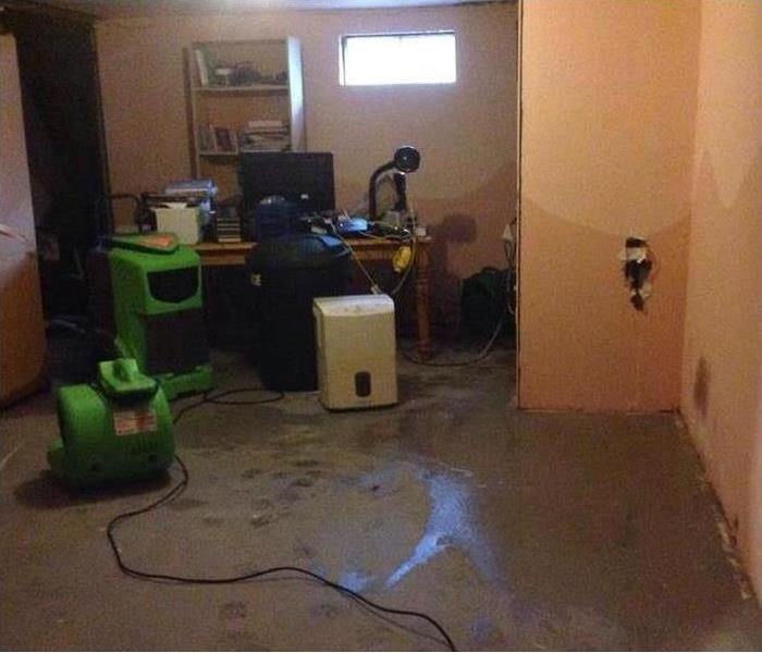 gear in basement, office desk, wet walls