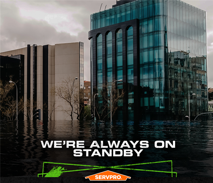 Flood water on the streets outside buildings downtown. 